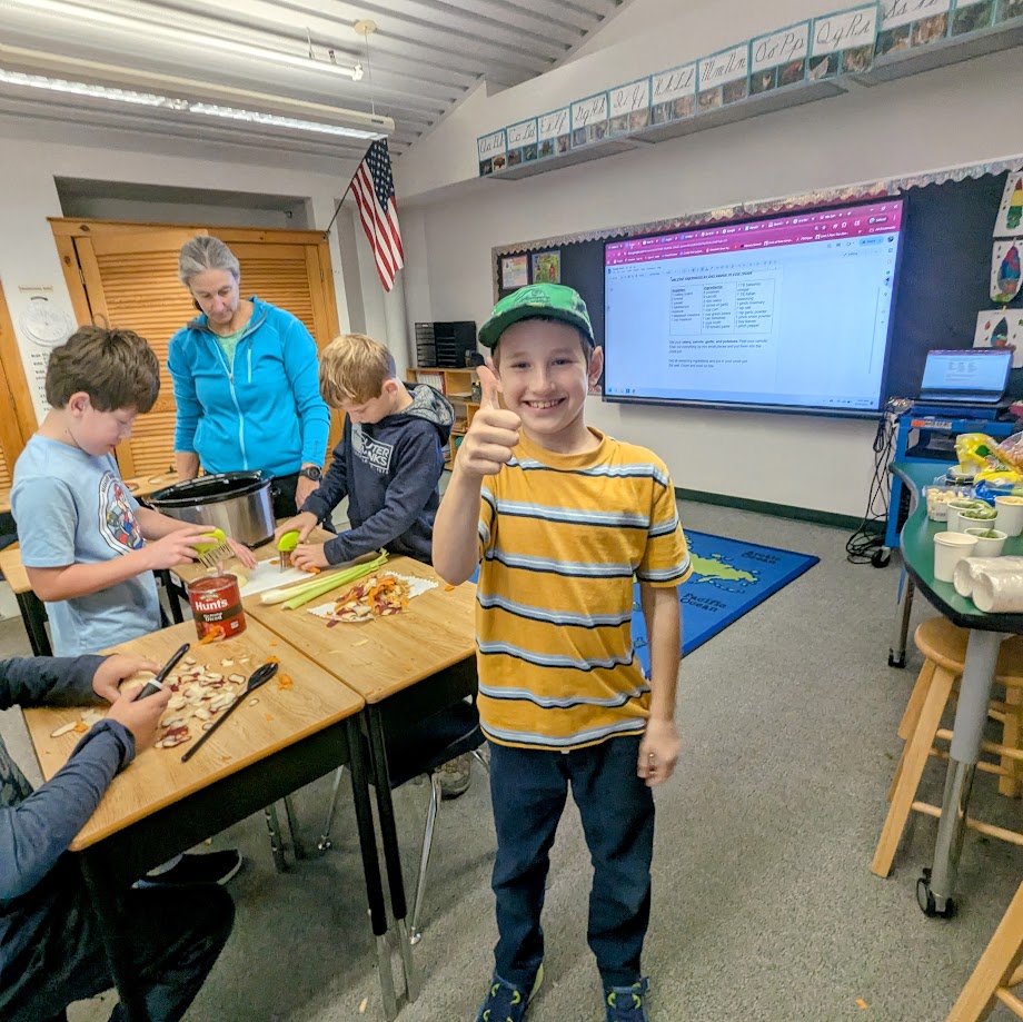 student giving thumbs up